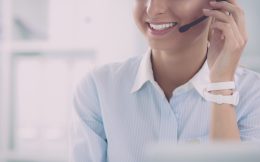 Portrait,Of,A,Customer,Service,Agent,Sitting,At,Office